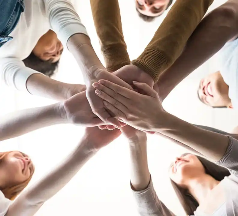 About everest peak home health care team joining hands with full of joy